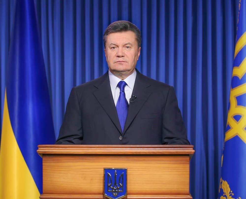 Ukrainos prezidentas Viktoras Janukovyčius sako neketinąs atsistatydinti ir įvykius sostinėje Kijeve įvardijo kaip „perversmą“. EPA-Eltos nuotr.