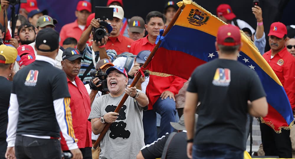 Venesueliečiai išėjo į gatves, jų palaikomą N. Maduro remia JTO, Katalonija, Graikija, o JAV ruošiasi karinei invazijai